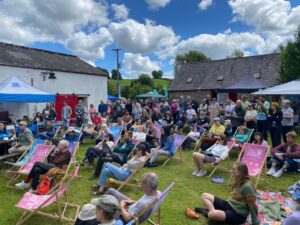 Beautiful people lounging in deckchairs watching the stage - Silverbrook Mill - taken by Jim